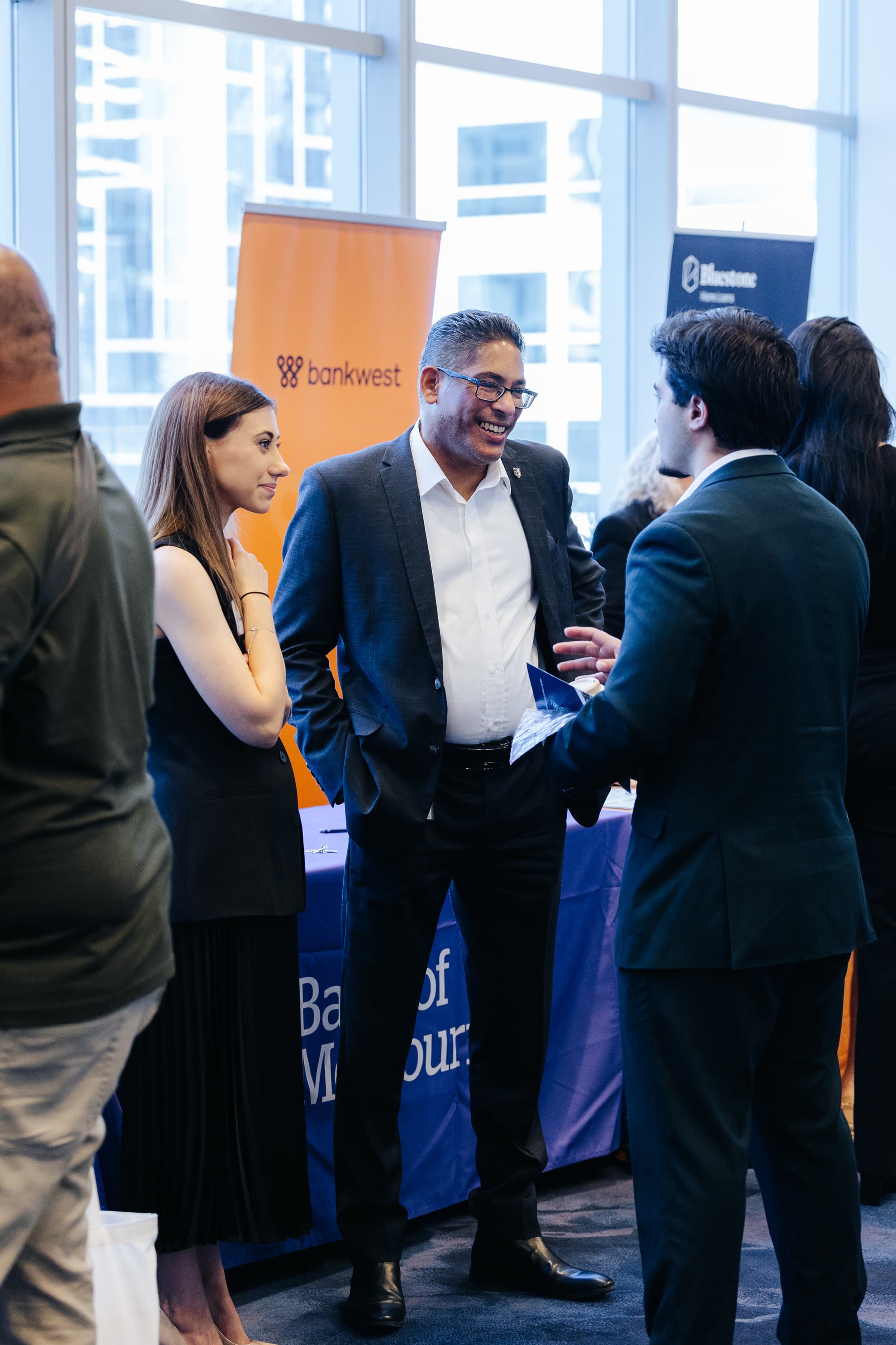 Broker speaking with a lender at an ExBanqi networking event
