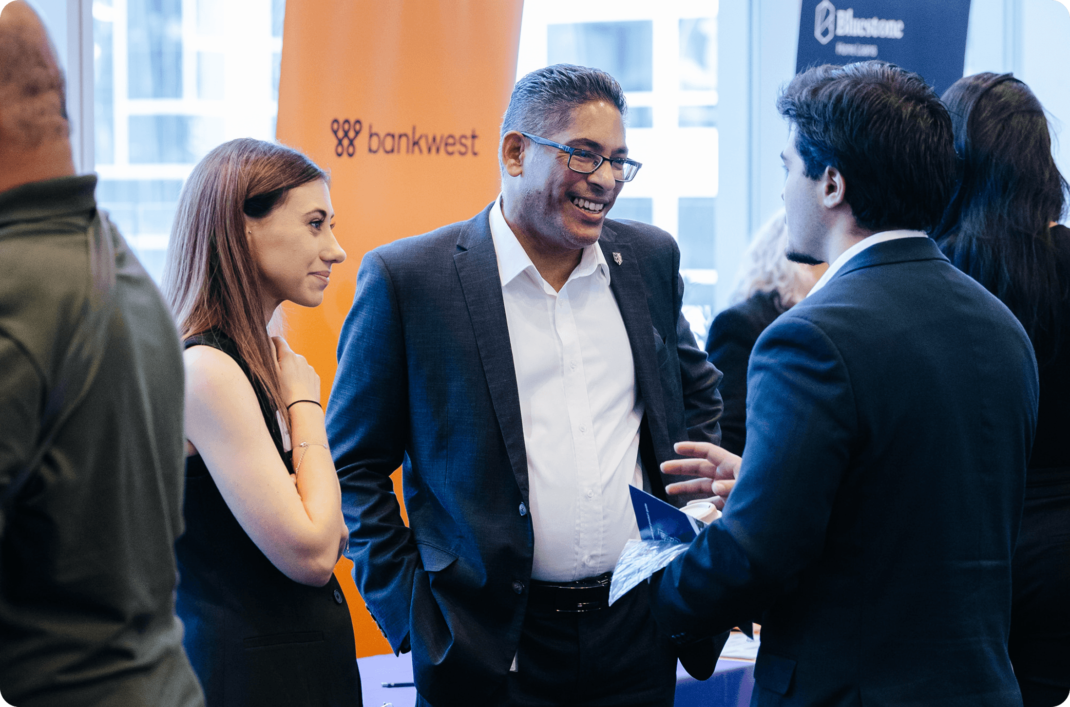Brokers networking at a lender event