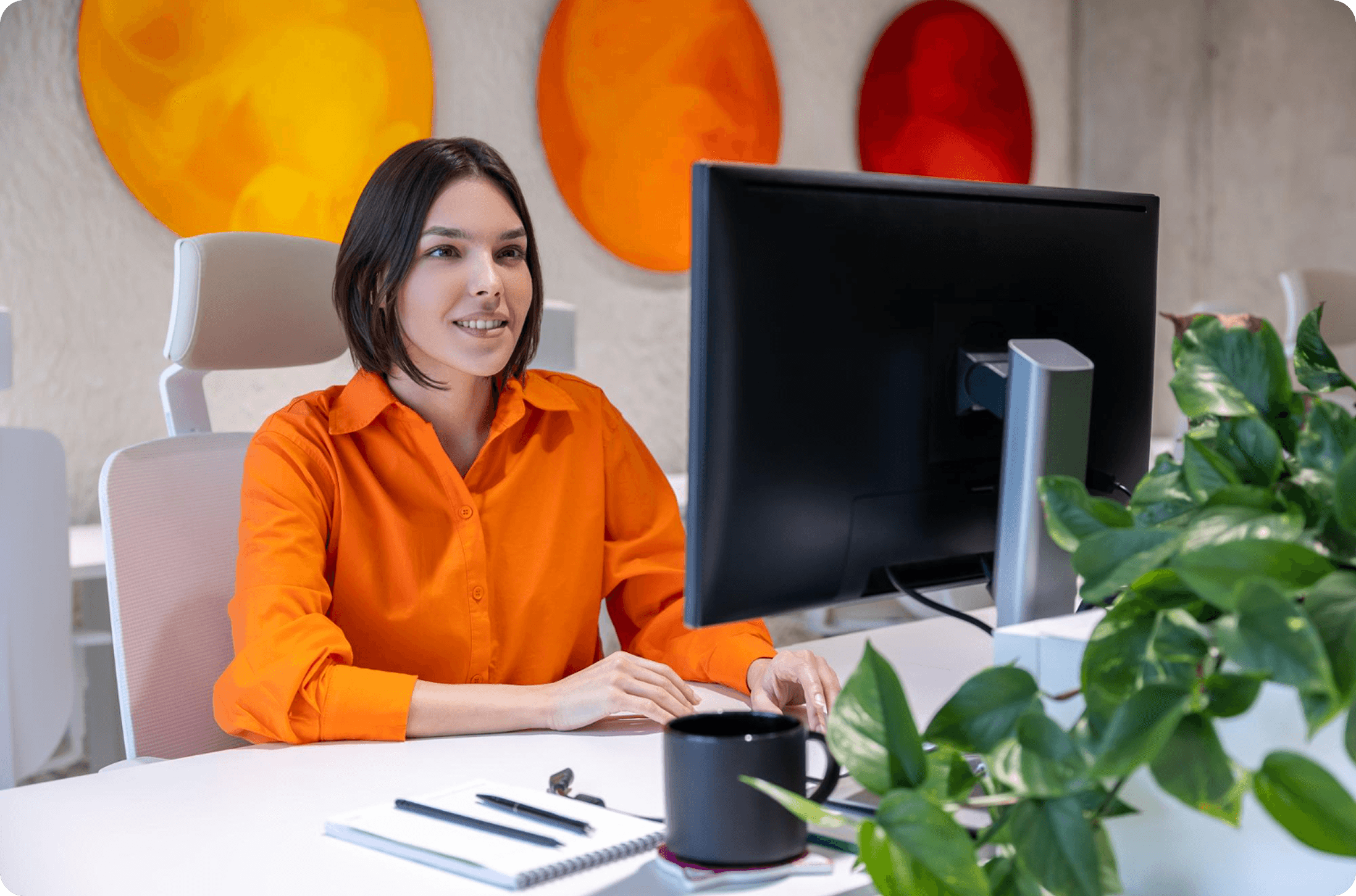Professional working at a desk in a modern office