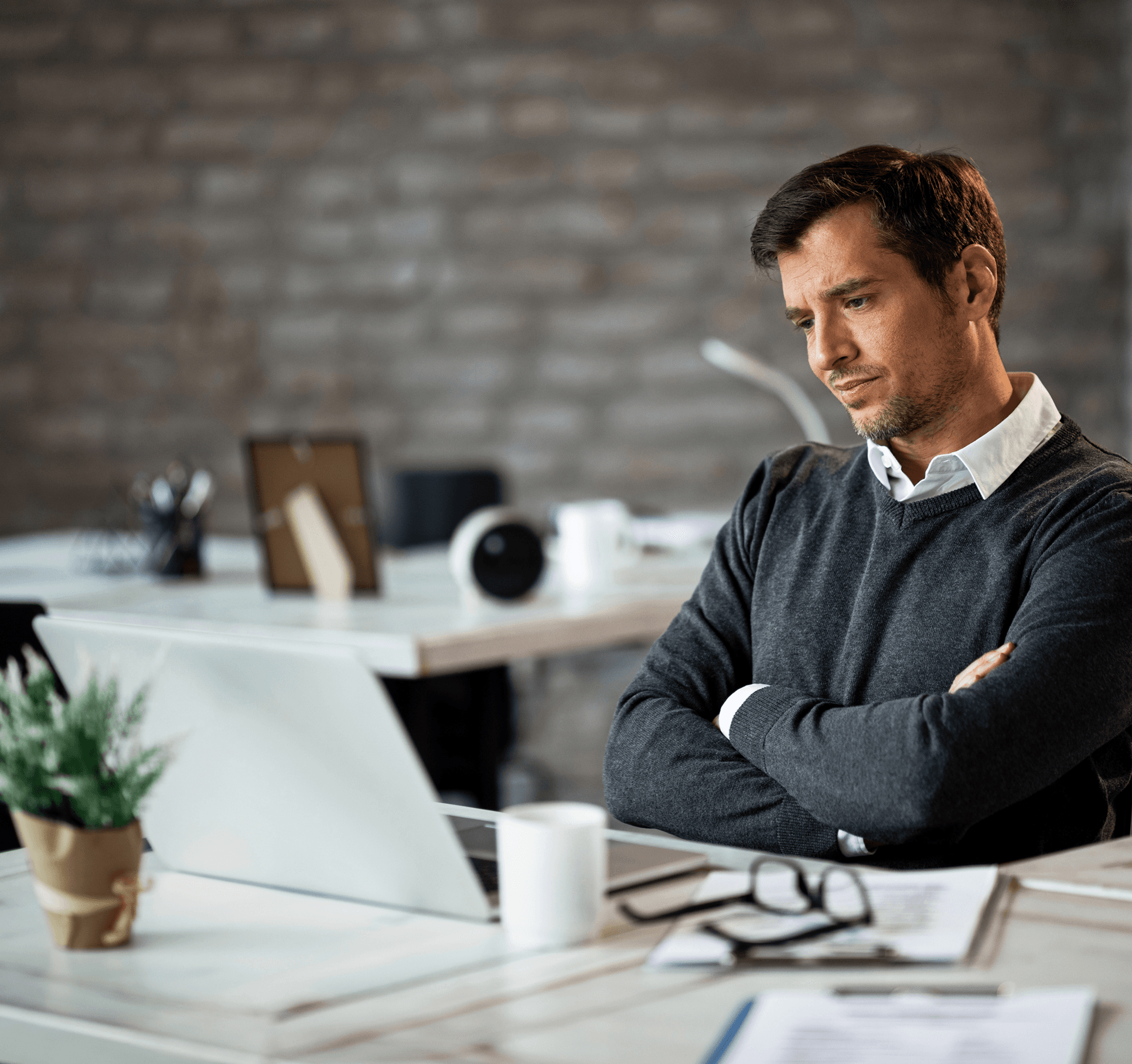 Broker reviewing finances at a desk